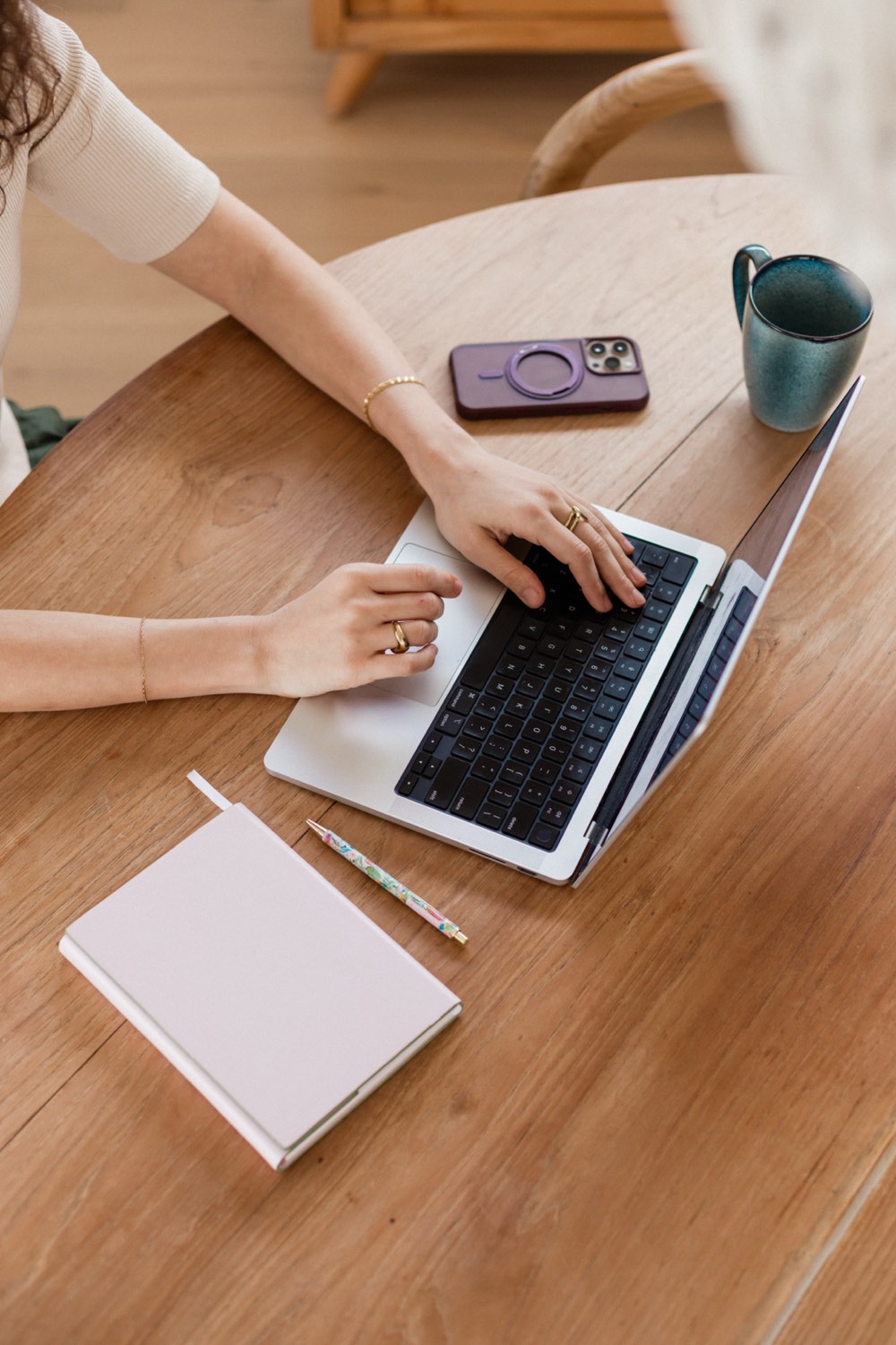 Bookkeeper working on a laptop at a desk, doing the books for an Australian small business